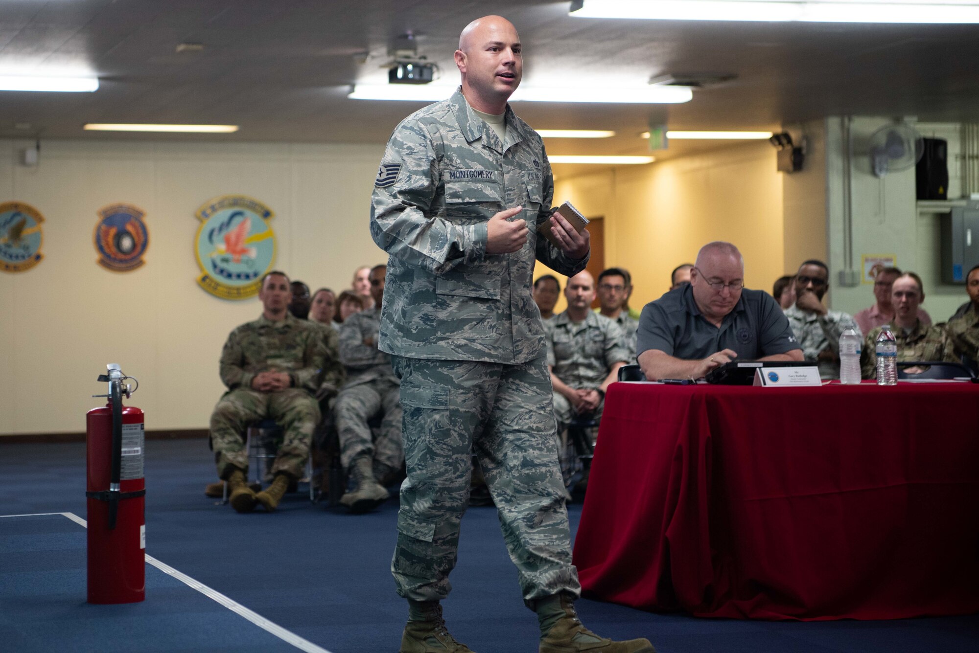 U.S. Air Force Tech. Sgt. Joshua Montgomery, 18th Civil Engineer Squadron firefighter, presents his idea for an environmentally friendly fire extinguisher disposal system May. 10, 2019, at Kadena Air Base, Japan.