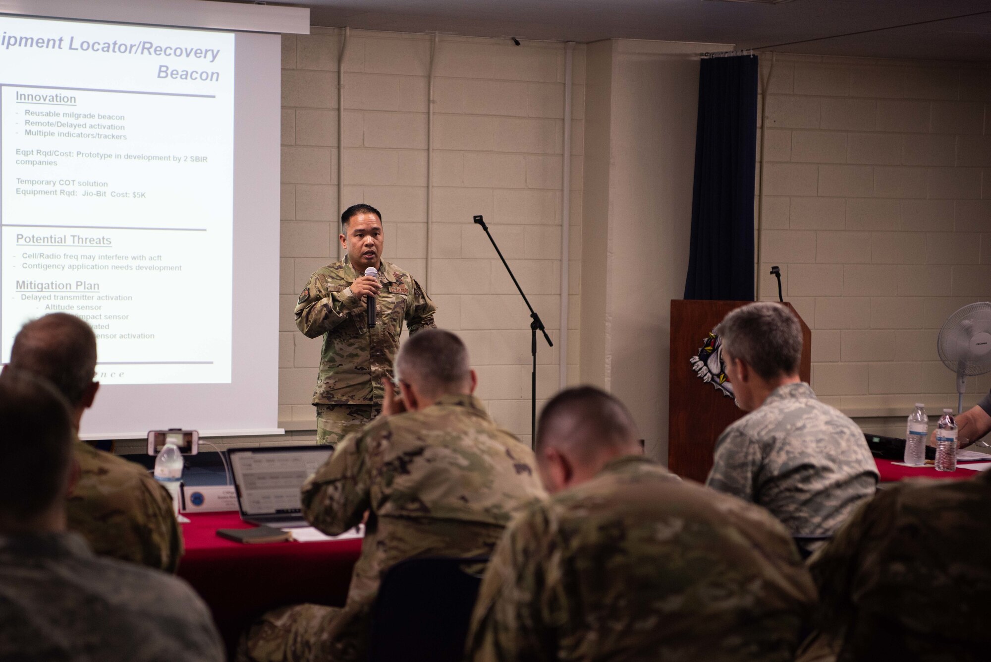 U.S. Air Force Master Sgt. Simedar Malinao, Air Force Special Operations Command aerial delivery support branch superintendent, discusses the need for reusable cargo covers May.10, 2019, at Kadena Air Base, Japan.