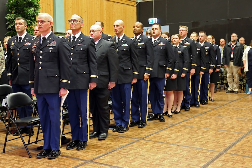 Intermediate Level Education (ILE) common core students stand at the start of a U.S. Army Command and General Staff Officers Course Common Core graduation ceremony hosted by the 7th ILE Detachment, 7th Mission Support Command, in Grafenwoehr, Germany, May 17, 2019. The 7th ILE DET offers a unique year-long ILE common core curriculum designed for multi-component officers deployed or stationed overseas.