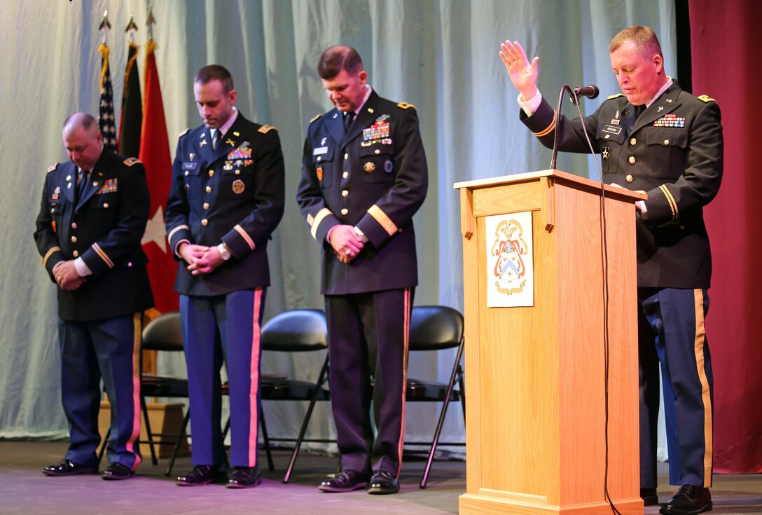 Chaplain (Maj.) Kevin Hovan, a common core graduate and chaplain with USAG Bavaria, leads the benediction during a U.S. Army Command and General Staff Officers Course Common Core graduation ceremony hosted by the 7th Intermediate Level Education Detachment, 7th Mission Support Command, in Grafenwoehr, Germany, May 17, 2019. The 7th ILE DET offers a unique year-long ILE common core curriculum designed for multi-component officers deployed or stationed overseas.