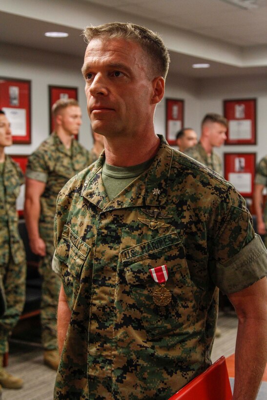 CAMP HUMPHREYS, Republic of Korea – Lt. Col. Thomas Bedell, liaison officer to 7th Air Force for U.S. Marine Corps Forces Korea, is awarded the Meritorious Service Medal at an awards ceremony here, May 6. Bedell received the Meritorious Service Medal for his outstanding efforts to support MARFORK and 7th Air Force during his time here in Korea. (Official U.S. Marine Corps photo by Sgt. Nathaniel Hanscom/Released)