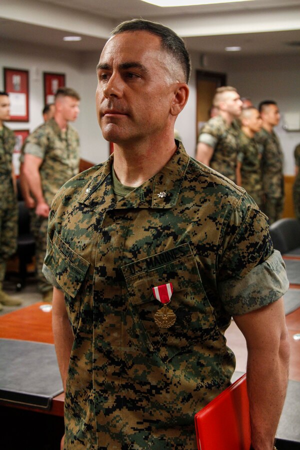 CAMP HUMPHREYS, Republic of Korea – Lt. Col. William Deleal U.S. Marine Corps Forces Korea Plans Officer, is awarded the Meritorious Service Medal at an awards ceremony here, May 6. Deleal received the Meritorious Service Medal for his outstanding contributions not only to MARFORK, but the whole of the U.S. Marine Corps after having assisted in developing doctrine to be used on the Korean peninsula. (Official U.S. Marine Corps photo by Sgt. Nathaniel Hanscom/Released)