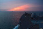 STRAIT OF MALACCA (May 18, 2018) The Arleigh Burke-class guided missile destroyer USS William P. Lawrence (DDG 110), transits the Strait of Malacca at Sunset. William P. Lawrence is deployed to the U.S. 7th Fleet area of operations in support of security and stability in the Indo-Pacific region.