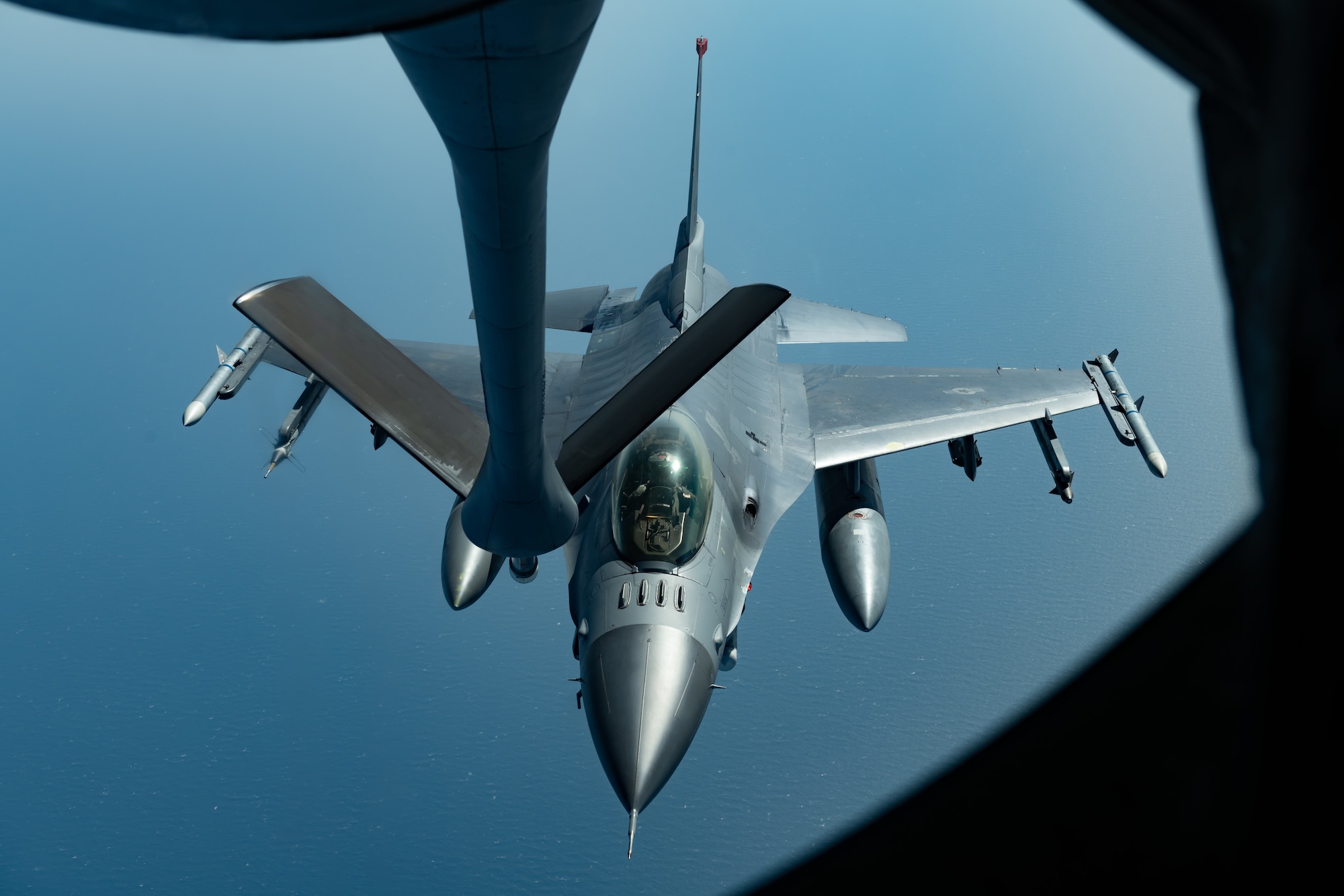 An F-16CM Fighting Falcon from the 35th Fighter Wing, Misawa Air Base, prepares to refuel with a KC-135 Stratotanker from the 909th Air Refueling Squadron, Kadena Air Base, during a routine training exercise off the coast of Japan, May 8, 2019. The 909th ARS helps ensure a free-and-open Indo-Pacific by providing air refueling to U.S., allies and partners within the area of responsibility. (U.S. Air Force photo by Airman 1st Class Matthew Seefeldt)