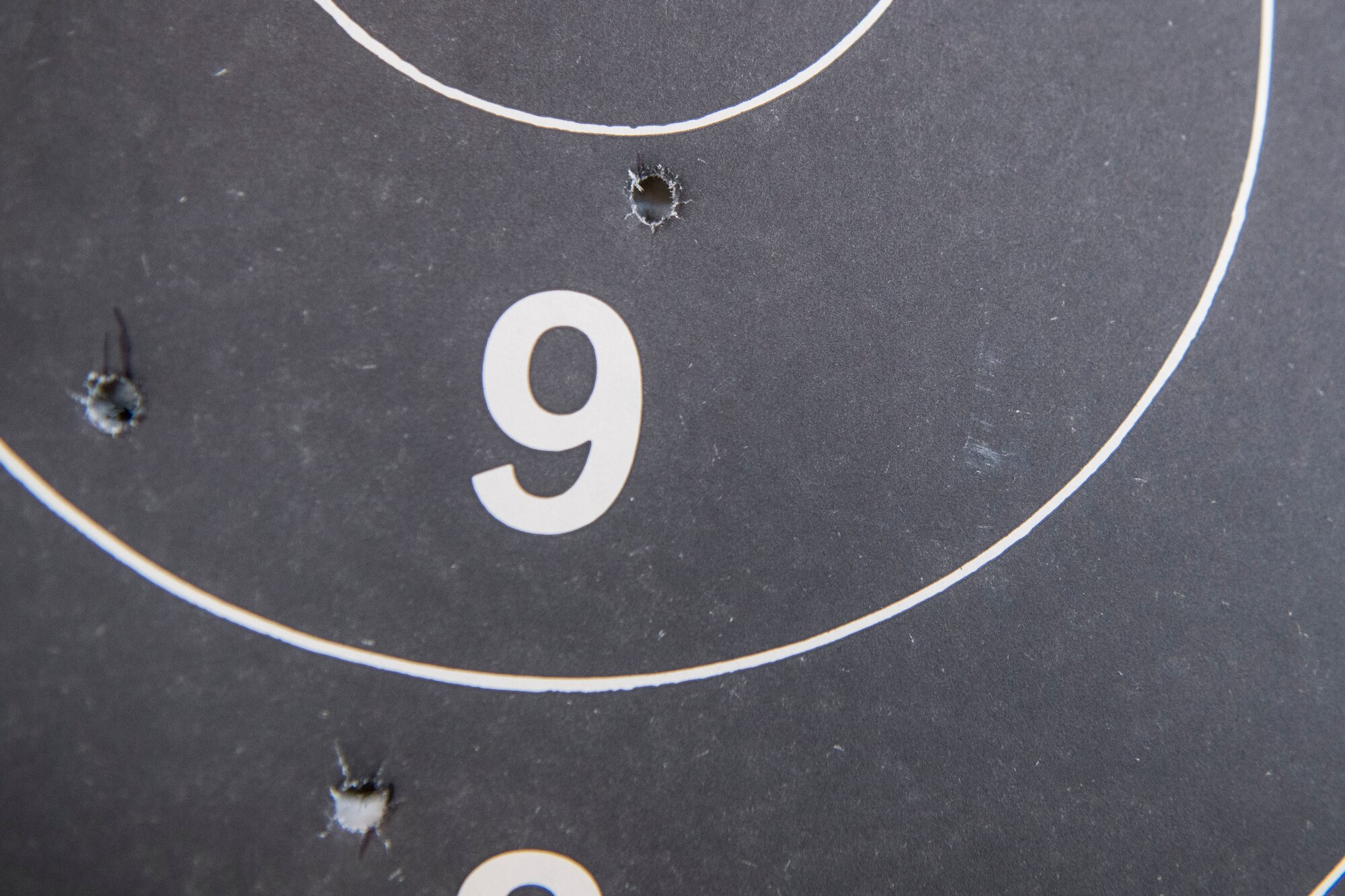 A target punctured with bullet waits to be tallied during a shooting competition on May 17, 2019, at Incirlik Air Base, Turkey. Competitors gained points based on how well they hit their targets, with the winner receiving a small prize at the end of the event. (U.S. Air Force photo by Senior Airman Joshua Magbanua)
