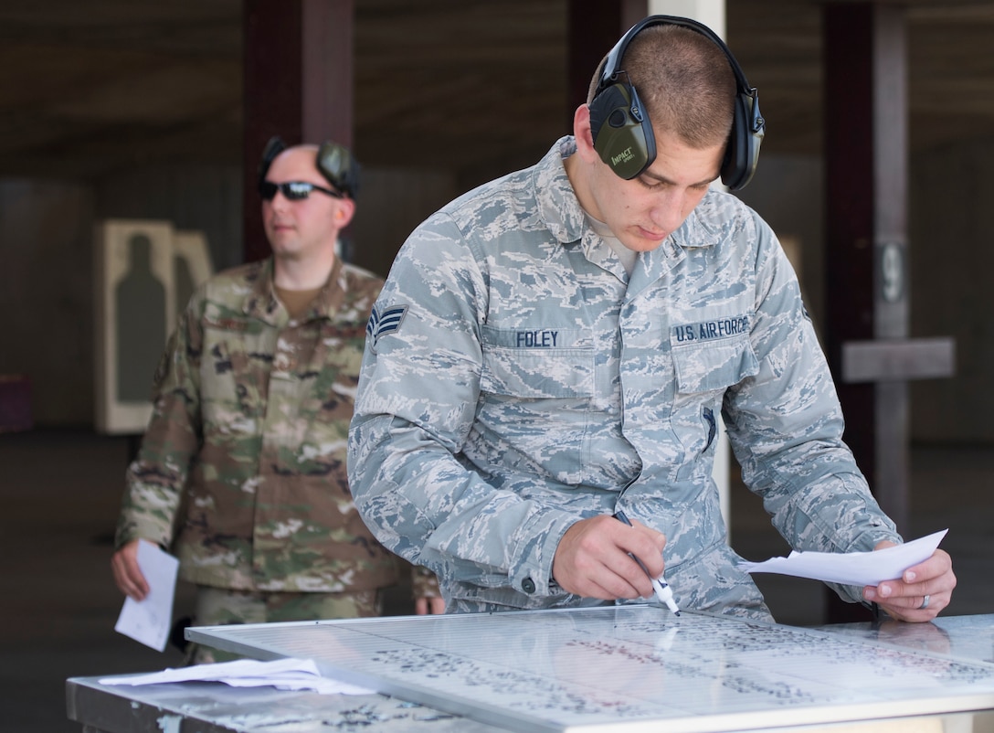 Senior Airman Cameron Foley, 39th Security Forces Squadron security response team member, checks contestants’ scores during a shooting competition on May 17, 2019, at Incirlik Air Base, Turkey. The 39th SFS invited Airmen from across Incirlik to participate in the competition as part of the 39th Air Base Wing’s Police Week observance. Police Week commemorates law enforcement officers who have fallen in the line of duty.(U.S. Air Force photo by Senior Airman Joshua Magbanua)