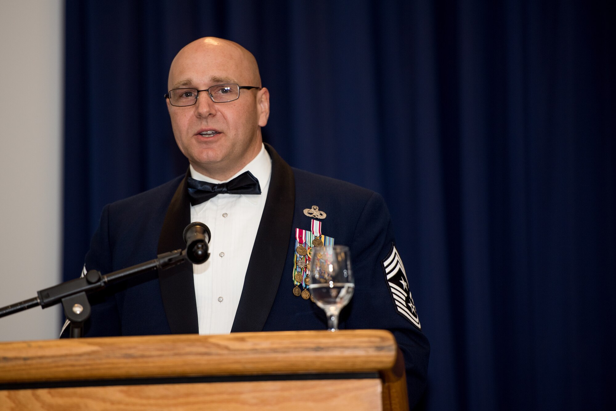 Chief Master Sgt. Anthony Green, 436th Airlift Wing command chief, speaks to  senior noncommissioned officer inductees during the senior noncommissioned officer induction ceremony at The Landings in Dover, Delaware, May 18, 2019. Thirty-two newly promoted staff sergeants were charged with new responsibilities as they accepted the role within their new rank. (U.S. Air Force photo by Capt. Katie Spencer)
