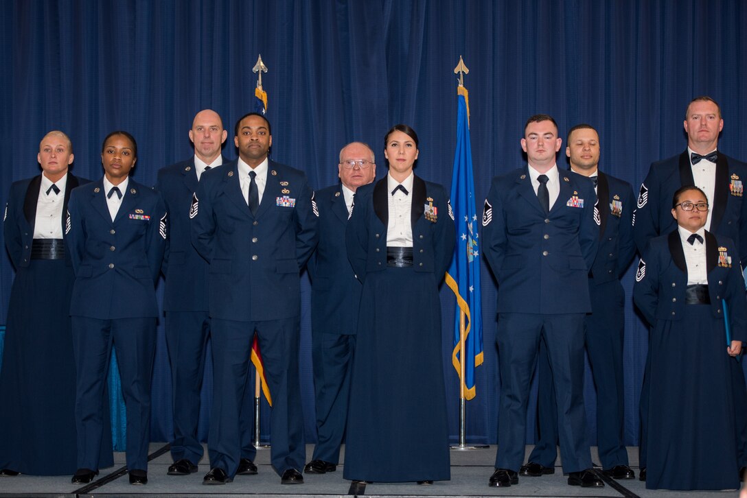 Airmen from the 512th Airlift Wing take center stage during a senior non-commissioned officer induction ceremony held at The Landings in Dover, Delaware, May 18, 2019. Thirty-two newly promoted master sergeants were charged with new responsibilities as they accepted the role within their new rank. (U.S. Air Force photo by Staff Sgt. Damien Taylor)