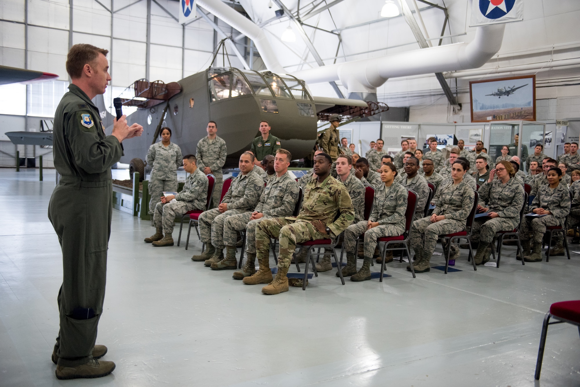 Col. Norman Shaw, 512th Airlift Wing vice commander, speaks to noncommissioned officer inductees during the noncommissioned officer induction ceremony at the Air Mobility Command Museum in Dover, Delaware, May 19, 2019. Seventy-seven newly promoted staff sergeants were charged with new responsibilities as they accepted the role within their new rank. (U.S. Air Force photo by Capt. Katie Spencer)