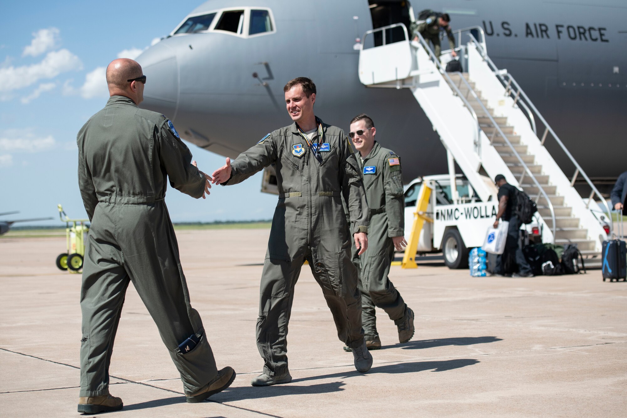 U.S. Air Force Col. Eric Carney, 97th Air Mobility Wing Commander, greets the crew from a newly arrived KC-46 Pegasus, May 18, 2019, at Altus Air Force Base, Okla. The two additional KC-46s are an important addition to the 97th AMW’s ability to deliver 21st century airpower. (U.S. Air Force photo by Airman 1st Class Breanna Klemm)