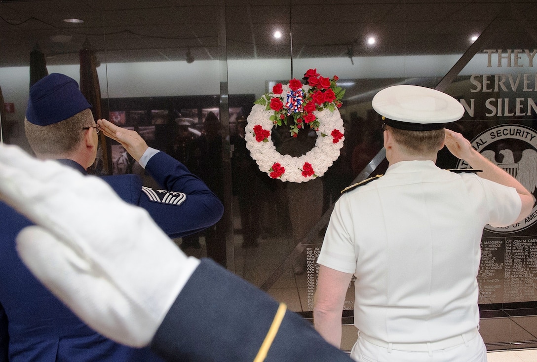 NSA-CSS leaders salute the Cryptologic Memorial Wall