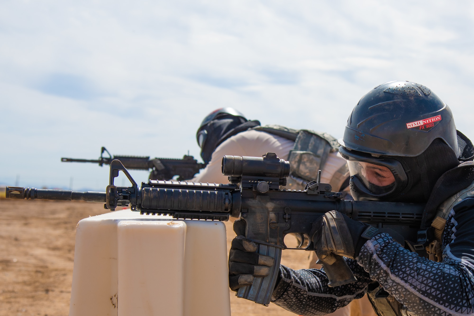 Staff Sgt. Elizabeth Pedroza, 56th Security Forces Squadron Military Working Dog handler, fires a weapon during a shooting course during the Police Week Tactical Competition May 16, 2019, at Luke Air Force Base, Ariz.