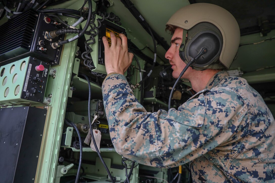 U.S. Marine Corps Cpl. Grant Weissbeck, a field radio operator, with 2nd Transportation Battalion, 2nd Combat Logistics Regiment, 2nd Marine Logistics Group, completes a radio check inside of a Light Armored Vehicle during exercise Arrow 2019 at Niinisalo Garrison, Finland, May 5, 2019. Exercise Arrow 2019 is an annual multinational exercise with the purpose of training mechanized infantry, artillery, and mortar field skills in a live-fire exercise along with the partners from the Finnish Defense Forces. (U.S. Marine Corps photo by Lance Cpl. Scott Jenkins)
