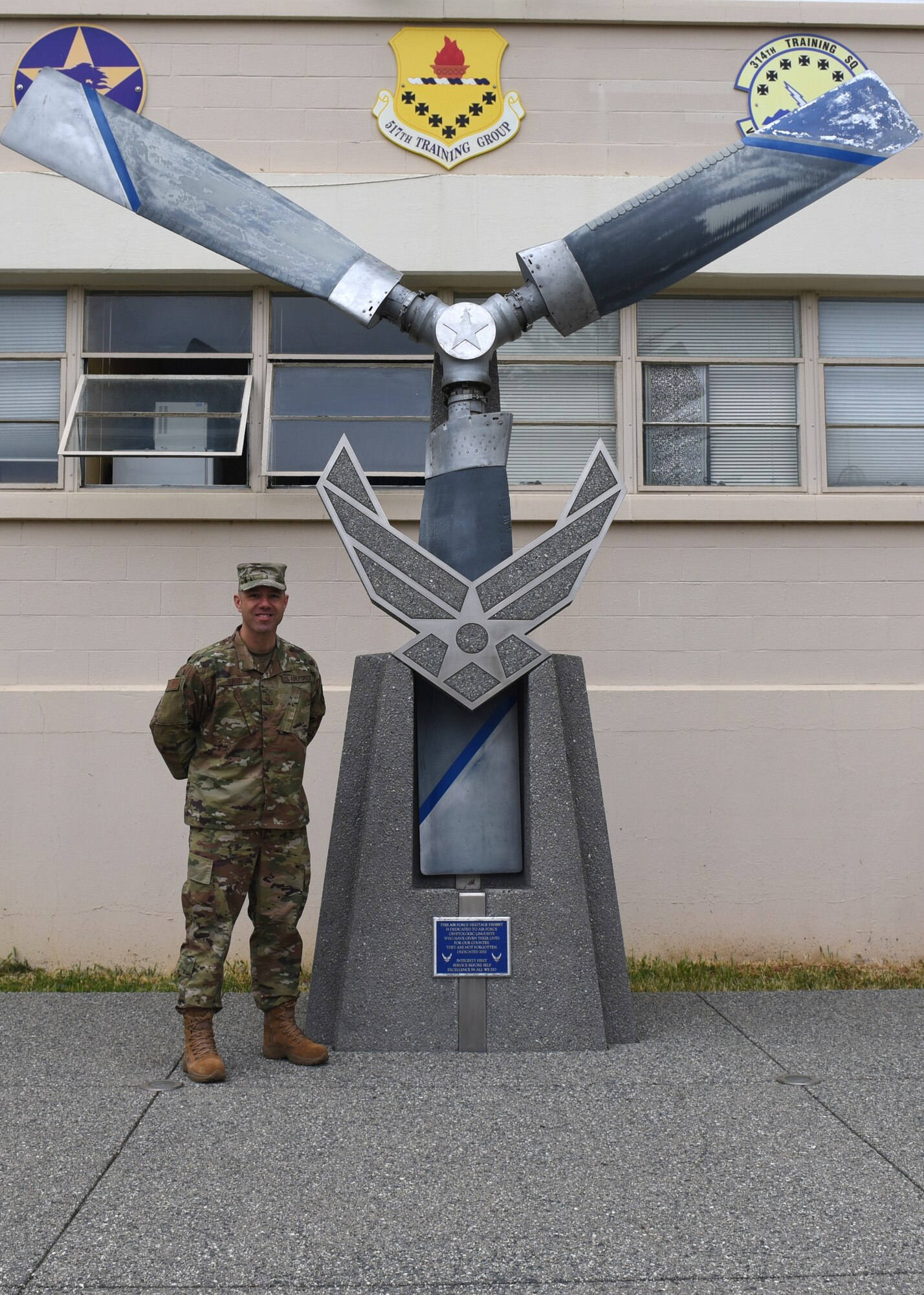 U.S. Air Force Chief Master Sgt. James Curtis, 311th Training Squadron first sergeant, stands with a heritage exhibit at Presidio of Monterey, Calif., May 6, 2019. Curtis has been the first sergeant for the 311th TRS for three years before being assigned to Nellis Air Force Base. (U.S. Air Force photo by Airman 1st Class Zachary Chapman/Released)
