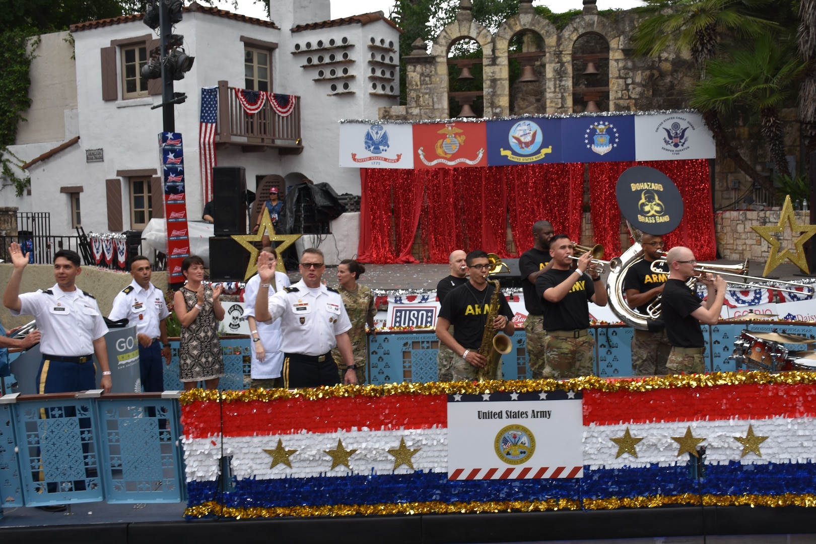 Brig. Gen. Bill Boruff waves to the crowd as the Army float passes the Arneson River Theater during the annual Armed Forces River Parade May 18 in downtown San Antoniox. This year's theme was "Salute Our Heroes." The parade promotes awareness of the joint presence and ties to the military families and community. Representing the U.S. Army in this year's parade were Boruff, commanding general, Mission and Installation Contracting Command; MICC Command Sgt. Maj. Marcos Torres,  and Capt. Jim Jimenez, aide de camp for the MICC commanding general.