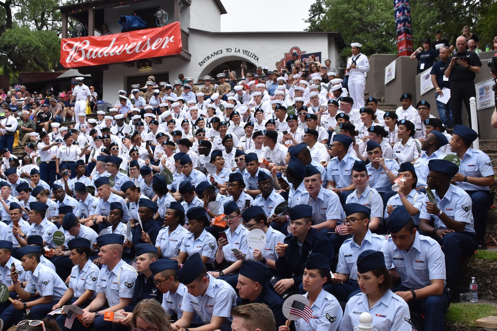 Military members from Joint Base San Antonio enjoy the festivities at the Arneson River Theater during the annual Armed Forces River Parade May 18 in downtown San Antonio. This year's theme was "Salute Our Heroes." The parade promotes awareness of the joint presence and ties to the military families and community. Representing the U.S. Army in this year's parade were Brig. Gen. Bill Boruff, Mission and Installation Contracting Command commanding general; MICC Command Sgt. Maj. Marcos Torres, and Capt. Jim Jimenez, aide de camp for the MICC commanding general.