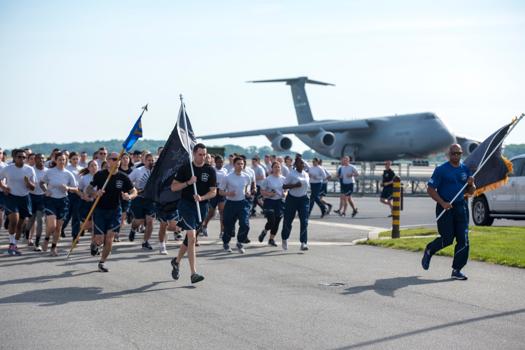 436th APS members run in formation.