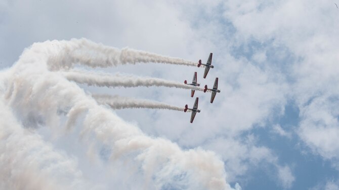 AT-6 Texans fly in formation during the Defenders of Liberty Air & Space Show at Barksdale Air Force Base, La., May 18, 2019. Originally designed as a basic trainer for the United States Army Air Corps, the Texan was the primary training platform for all U.S. Airmen in World War II that went on to fly fighter aircraft such as the P-51 Mustang, F4U Corsair, P-40 Warhawk, and others. (U.S. Air Force photo by Airman Jacob B. Wrightsman)