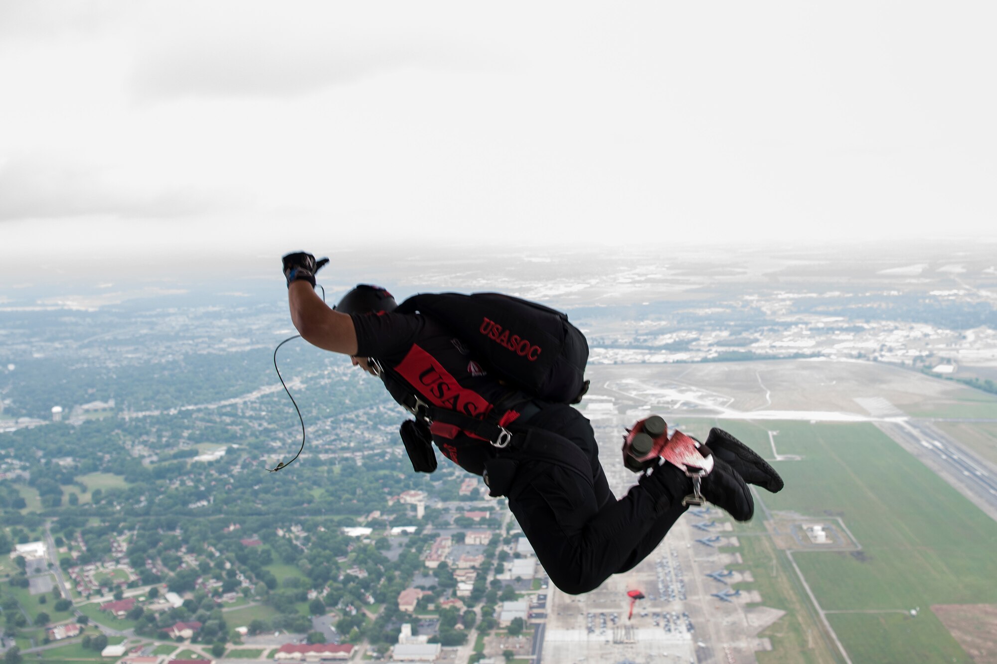 A Soldier, from the U.S. Army Special Operations Command Black Daggers Parachute Demonstration Team jumps from an aircraft during the Defenders of Liberty Air & Space Show at Barksdale Air Force Base, La., May 18, 2019. The team’s mission is to perform live aerial demonstrations in support of Army Special Operations community relations and recruiting. (U.S. Air Force photo by Airman 1st Class Katelin Britton)