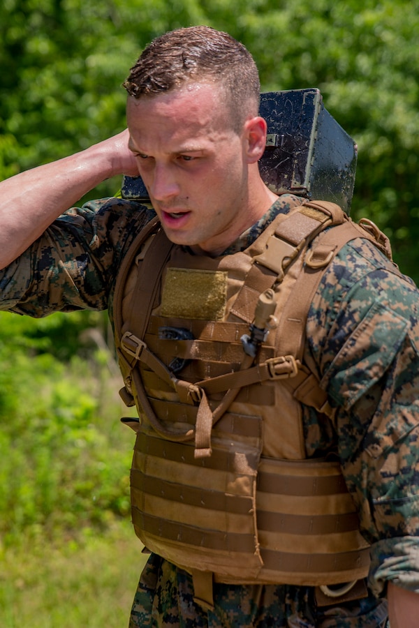 U.S. Marine Corps Staff Sgt. Zachary Hilko, an aviation supply chief with Marine Aircraft Group 49, 4th Marine Aircraft Wing, Marine Forces Reserve, participates in a 3-mile run at Naval Air Station Joint Reserve Base New Orleans on May 15, 2019. The students were required to carry ammo cans and mokuju bayonet trainers throughout the entire run and for each obstacle. To increase readiness and to support the total force, Reserve and active Marines with MARFORRES participate in the Martial Arts Instructor Course.  (U.S. Marine Corps photo by Lance Cpl. Jose Gonzalez)