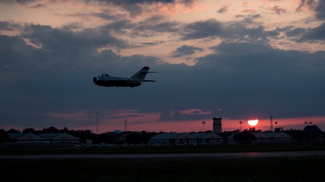 A MiG-17F performs a flyover during the Twilight Show at Barksdale Air Force Base, La., May 17, 2019. The Twilight Show allowed air and ground crews to practice processes and procedures a day before the Defenders of Liberty Air & Space Show. (U.S. Air Force photo by Staff Sgt. Damon Kasberg)