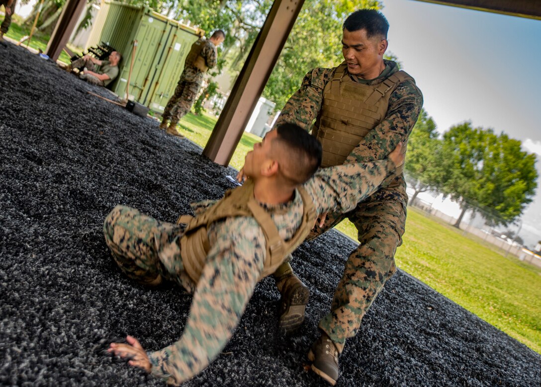 Marines with Martial Arts Instructor Course 1-19 conduct a 3-mile run
