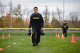 A Soldier assigned to Fort Drum, N.Y. carries two 40 pound kettle bells during a field test for the new Army Combat Fitness Test, Nov. 1, 2018. (U.S. Army photo by Staff Sgt. James Avery)