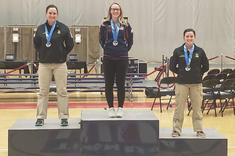 A woman stands on a podium.