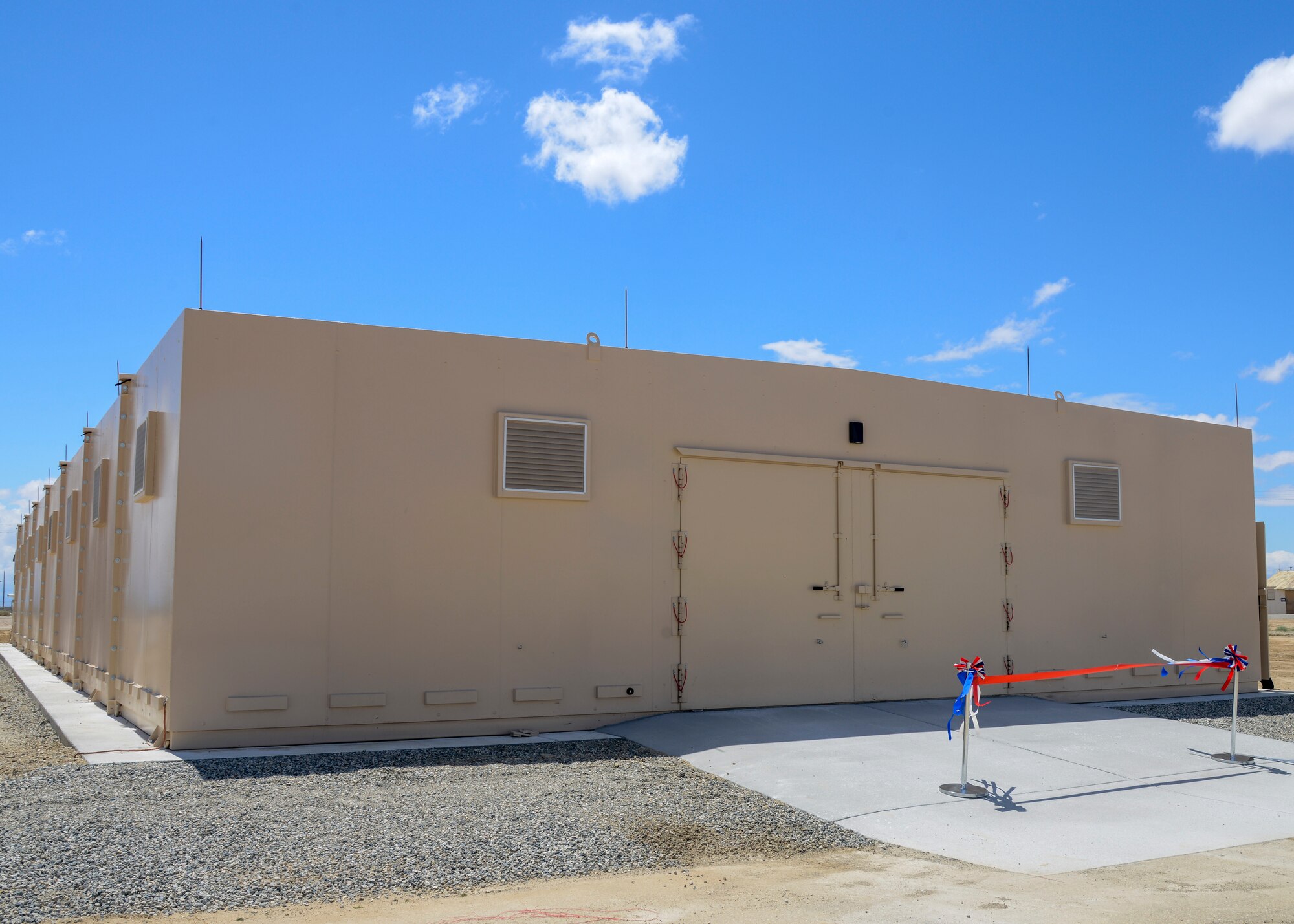 The new munitions bunker is 5,000 square feet and includes eight modular sections. The ribbon cutting ceremony took place at Edwards Air Force Base, Calif. May 16. (U.S. Air Force photo by Giancarlo Casem)