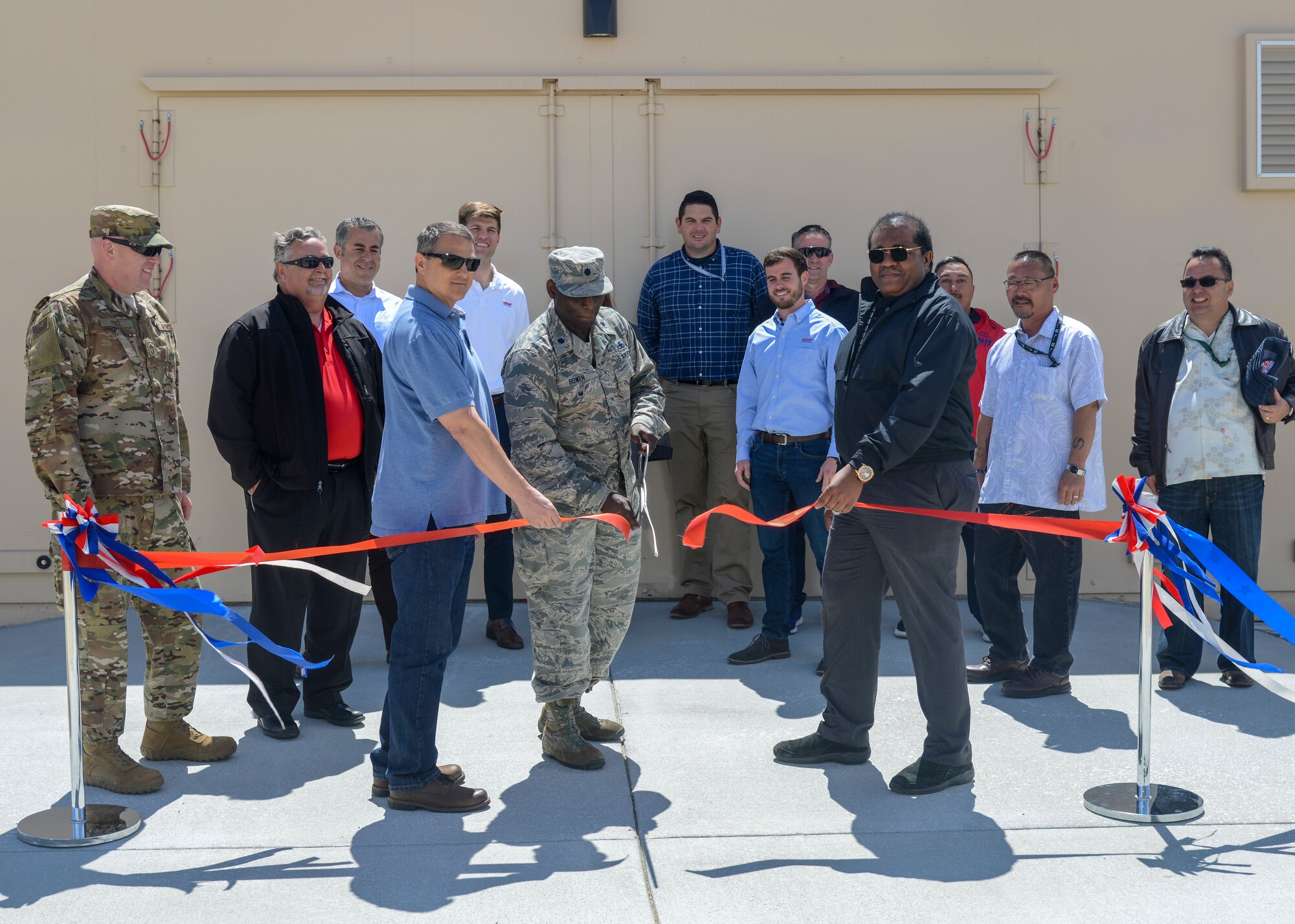 Lt. Col. Arnold Bowen, 412th Maintenance Group Deputy Commander, cuts the ribbon to officially open a new munitions bunker during a ceremony at Edwards Air Force Base, Calif. May 16. (U.S. Air Force photo by Giancarlo Casem)