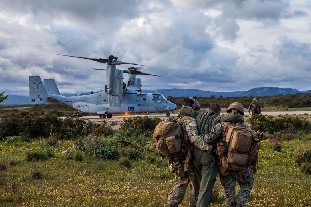 U.S. Marines with Special Purpose Marine Air-Ground Task Force-Crisis-Response-Africa 19.2, Marine Forces Europe and Africa, and a U.S. Air Force pararescue jumper evacuate a simulated isolated and injured service member during a tactical recovery of aircraft and personnel rehearsal near Perdasdefogu, Sardinia, Italy, May 13, 2019.