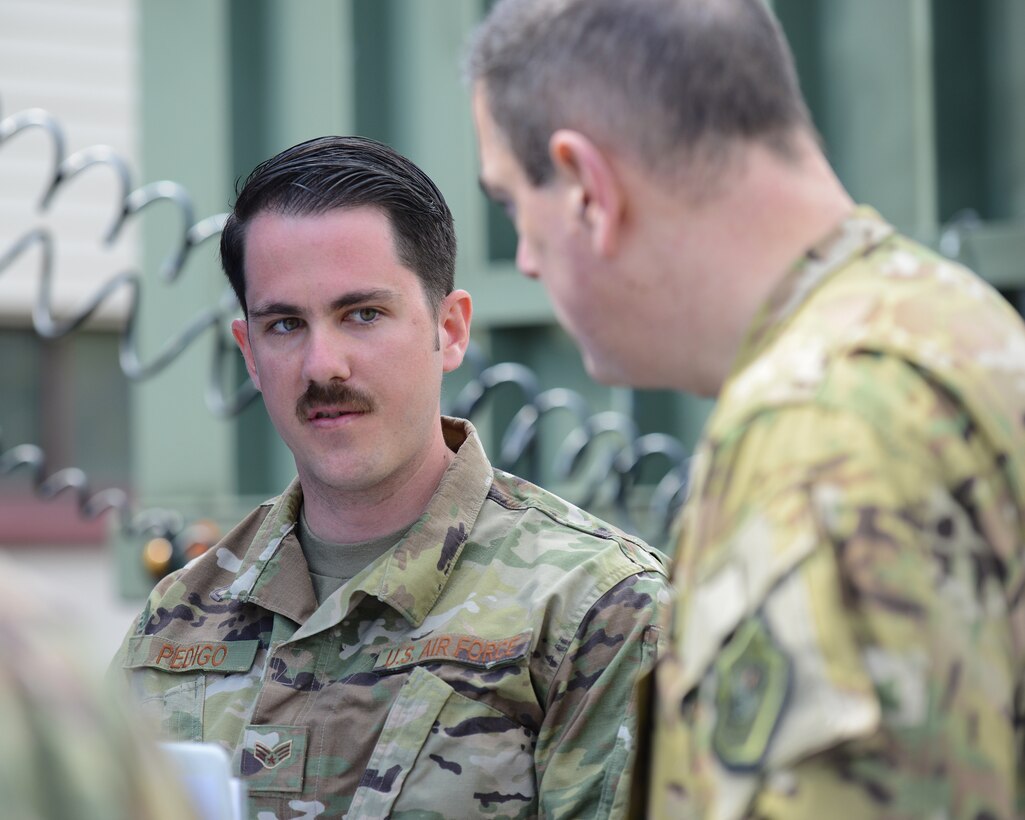 U.S. Air Force Senior Airman Josh Pedigo, 86th Vehicle Readiness Squadron vehicle operator, speaks with Brig. Gen. Mark R. August, 86th Airlift Wing commander on Ramstein Air Base, Germany, May 17, 2019.
