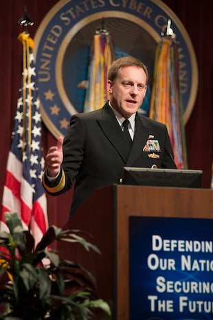 ADM Michael Rogers, USN, addresses the audience and the CYBERCOM, NSA, and CSS workforces at his Assumption of Command ceremony, 03 April 2014