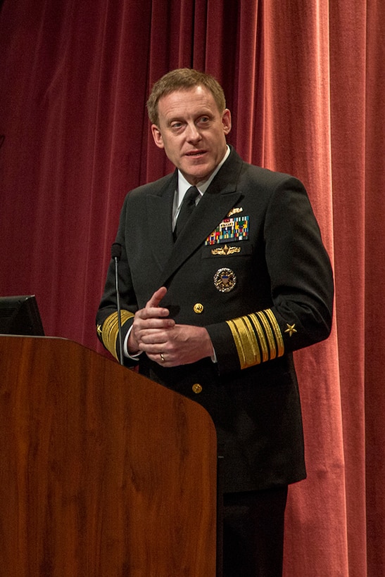 ADM Michael Rogers, USN, addresses the audience and the CYBERCOM, NSA, and CSS workforces at his Assumption of Command ceremony, 03 April 2014