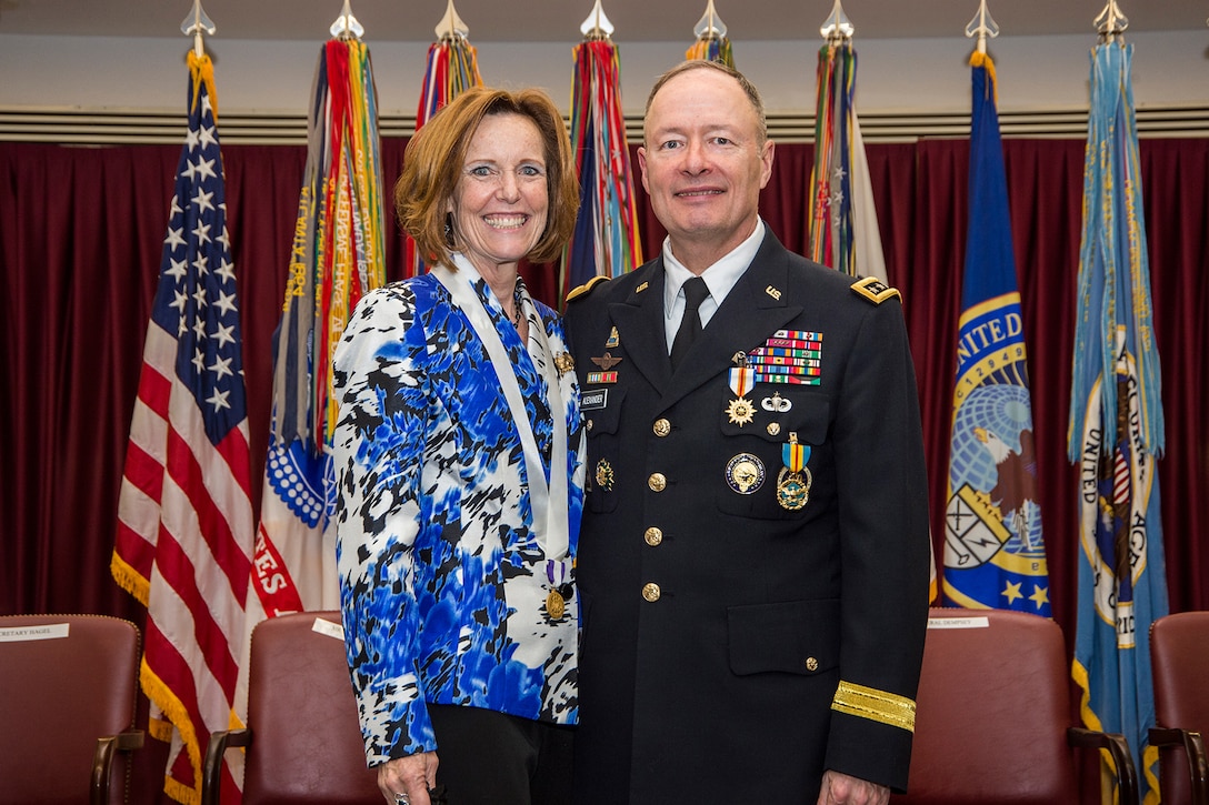 GEN Keith Alexander, USA, and Mrs. Debbie Alexander at his retirement ceremony, 28 March 2014