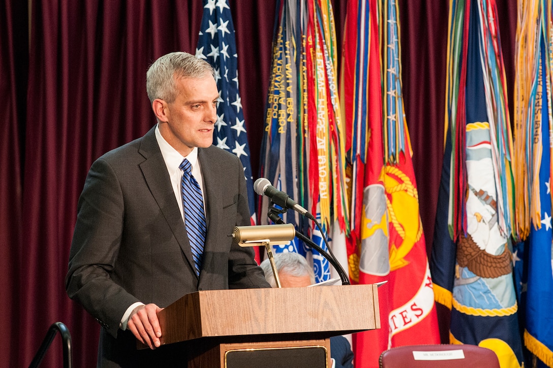 White House Chief of Staff Denis McDonough addresses attendees at the retirement ceremony for GEN Keith Alexander, USA, on March 28, 2014