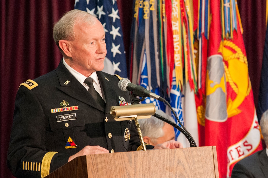 Chairman of the Joint Chiefs of Staff, GEN Martin Dempsey, USA, addresses attendees at the retirement ceremony for GEN Keith Alexander, USA, on March 28, 2014