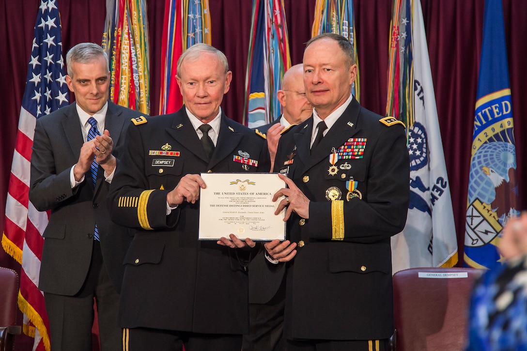 Chairman of the Joint Chiefs of Staff, GEN Martin Dempsey, USA, awards GEN Keith Alexander, USA, the Defense Distinguished Service Medal on Alexander's retirement, March 28, 2014