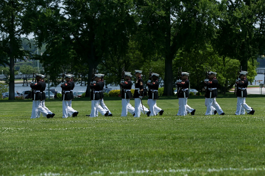 Marines with the U.S. Marine Corps Silent Drill Platoon, Marine Barracks Washington D.C., march in formation during a Battle Color Ceremony at the United States Naval Academy in Annapolis, Maryland, May 20, 2019. Parents, family members and guests of the First Class Midshipmen were invited to attend a series of events, in honor of the graduates. (U.S. Marine Corps photo by Pfc. Allen Sanders)