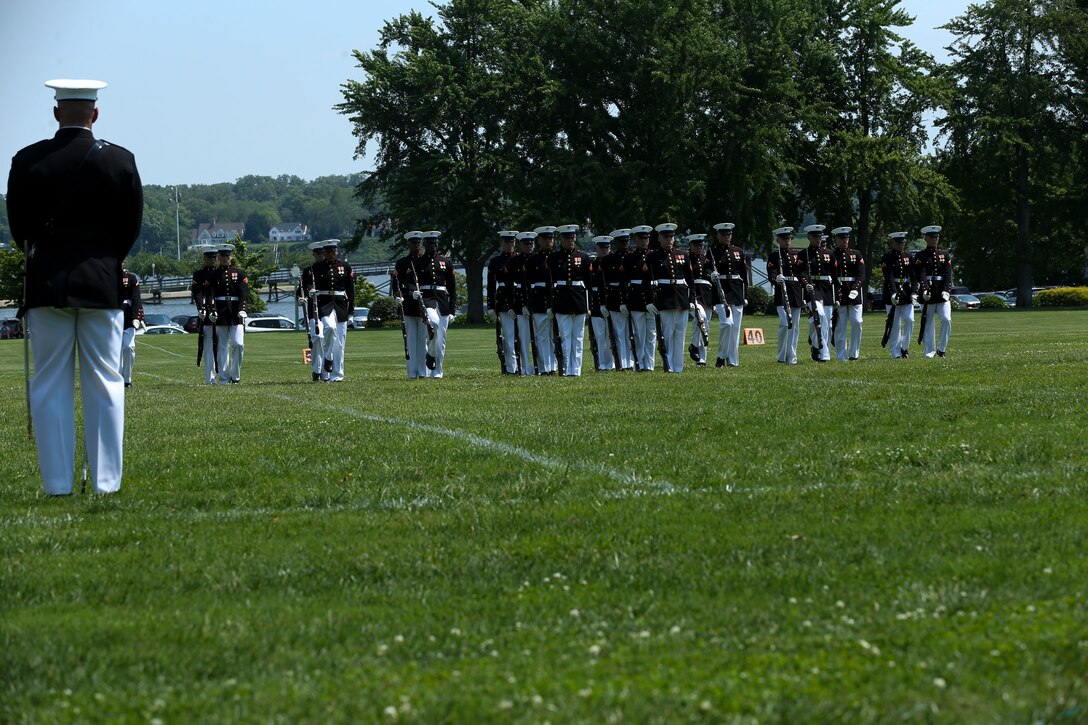Captain Alexander Newham, platoon commander, U.S. Marine Corps Silent Drill Platoon, stands at ceremonial parade rest during a Battle Color Ceremony at the United States Naval Academy in Annapolis, Maryland, May 20, 2019. Parents, family members and guests of the First Class Midshipmen were invited to attend a series of events, in honor of the graduates. (U.S. Marine Corps photo by Pfc. Allen Sanders)