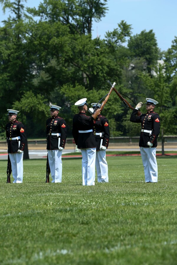 Marines with the U.S. Marine Corps Silent Drill Platoon, Marine Barracks Washington D.C., perform their “Rifle Inspection” sequence during a Battle Color Ceremony at the United States Naval Academy in Annapolis, Maryland, May 20, 2019. Parents, family members and guests of the First Class Midshipmen were invited to attend a series of events, in honor of the graduates. (U.S. Marine Corps photo by Pfc. Allen Sanders)