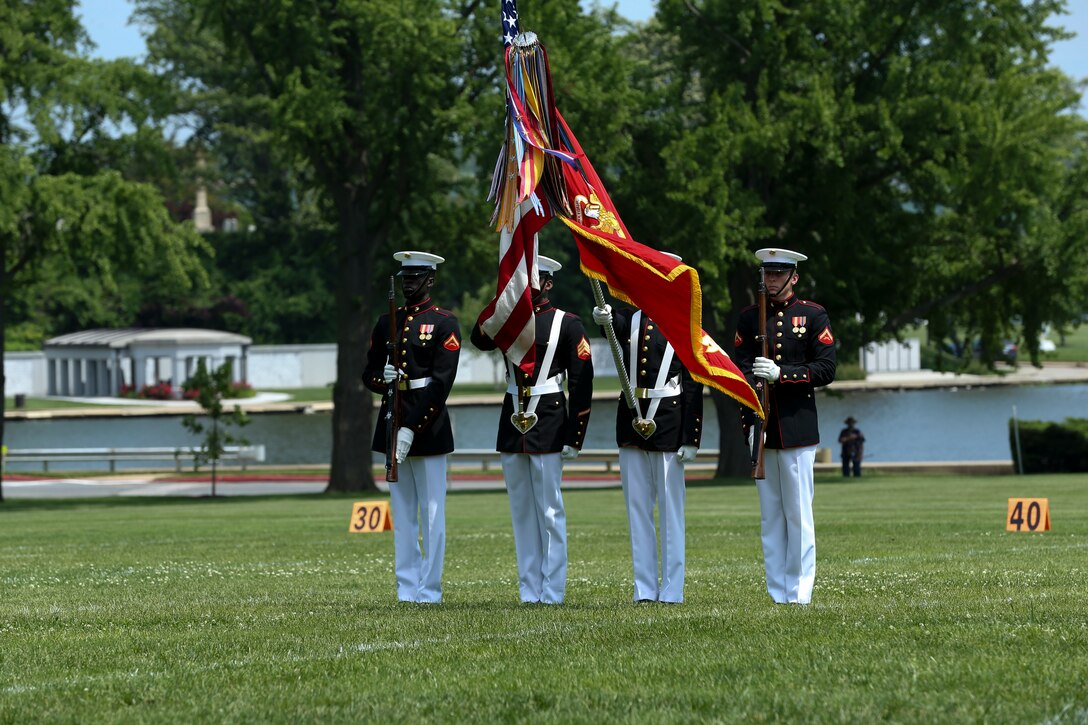 The U.S. Marine Corps Color Guard dips the Marine Corps Battle Colors during a Battle Color Ceremony at the United States Naval Academy in Annapolis, Maryland, May 20, 2019. Parents, family members and guests of the First Class Midshipmen were invited to attend a series of events, in honor of the graduates. (U.S. Marine Corps photo by Pfc. Allen Sanders)