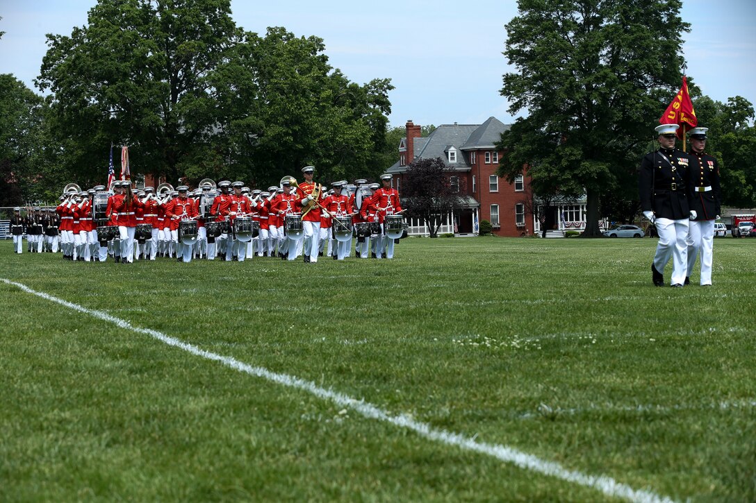 Marines with Marine Barracks Washington, D.C., perform “Pass in Review” during a Battle Color Ceremony at the United States Naval Academy in Annapolis, Maryland, May 20, 2019. Parents, family members and guests of the First Class Midshipmen were invited to attend a series of events, in honor of the graduates. (U.S. Marine Corps photo by Pfc. Allen Sanders)