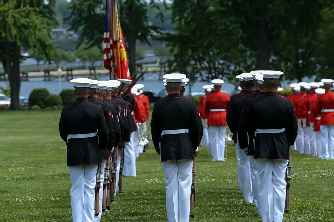 Marines with the U.S. Marine Corps Silent Drill Platoon, Marine Barracks Washington D.C., stand in formation during a Battle Color Ceremony at the United States Naval Academy in Annapolis, Maryland, May 20, 2019. Parents, family members and guests of the First Class Midshipmen were invited to attend a series of events, in honor of the graduates. (U.S. Marine Corps photo by Pfc. Allen Sanders)