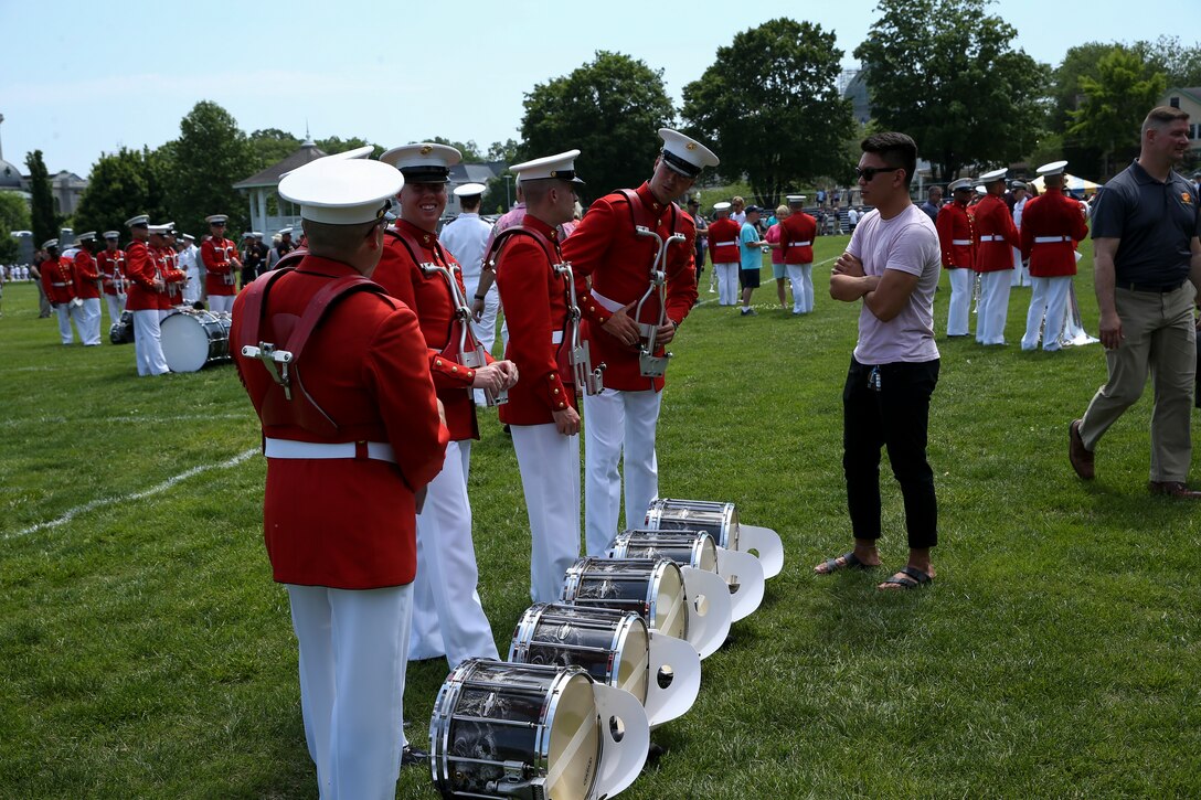 Marines with “The Commandant's Own,” U.S. Marine Drum and Bugle Corps, meet and greet with guests after a Battle Color Ceremony at the United States Naval Academy in Annapolis, Maryland, May 20, 2019. Parents, family members and guests of the First Class Midshipmen were invited to attend a series of events, in honor of the graduates. (U.S. Marine Corps photo by Pfc. Allen Sanders)