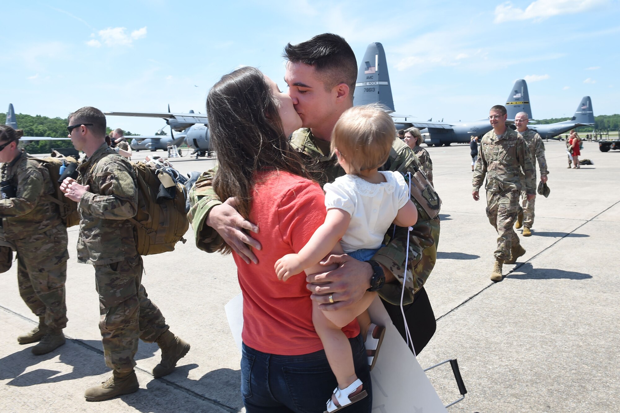 An Airman kisses his wife on the flight line