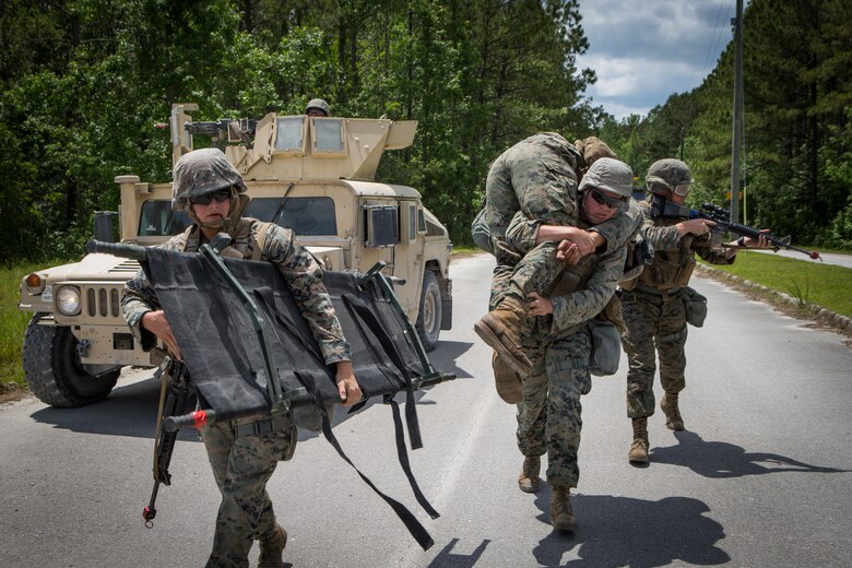 U.S. Marines with Combat Logistics Battalion 8, Combat Logistics Regiment 2, 2nd Marine Logistics Group, evacuate a casualty during a training exercise at Camp Lejeune, N.C., May 16, 2019. CLB 8 held the exercise to train Marines in core mission tasks and provide company-level convoy operations training. (U.S. Marine Corps photo by Cpl. Damion Hatch)