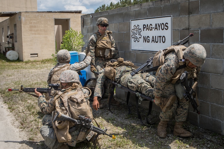 U.S. Marines with Combat Logistics Battalion 8, Combat Logistics Regiment 2, 2nd Marine Logistics Group, evacuate a casualty during a training exercise at Camp Lejeune, N.C., May 16, 2019. CLB 8 held the exercise to train Marines in core mission tasks and provide company-level convoy operations training. (U.S. Marine Corps photo by Cpl. Damion Hatch)