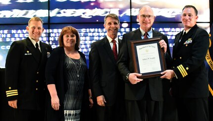 IMAGE: Gilbert Goddin receives the Navy Superior Civilian Service Award during the NSWCDD annual honorary awards ceremony, May 10. Standing left to right: NSWCDD Dam Neck Activity Commanding Officer Cmdr. Andrew Hoffman; NSWCDD Deputy Technical Director Angela Beach; U.S. Rep. Rob Wittman; Goddin; and NSWCDD Commanding Officer Cmdr. Stephen ‘Casey’ Plew.