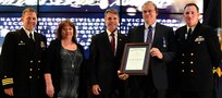 IMAGE: Mark Bradshaw receives the Navy Superior Civilian Service Award during the NSWCDD annual honorary awards ceremony, May 10. Standing left to right: NSWCDD Dam Neck Activity Commanding Officer Cmdr. Andrew Hoffman; NSWCDD Deputy Technical Director Angela Beach; U.S. Rep. Rob Wittman; Bradshaw; and NSWCDD Commanding Officer Cmdr. Stephen ‘Casey’ Plew.